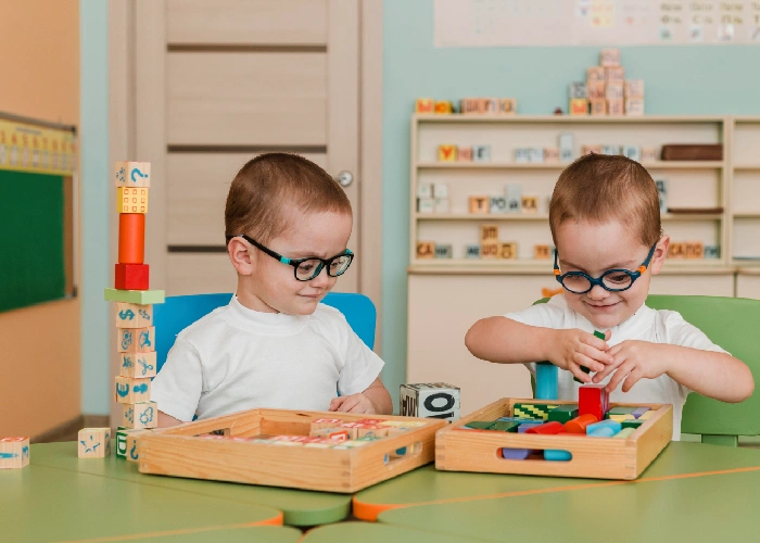 Playschool kids exploring books and educational toys